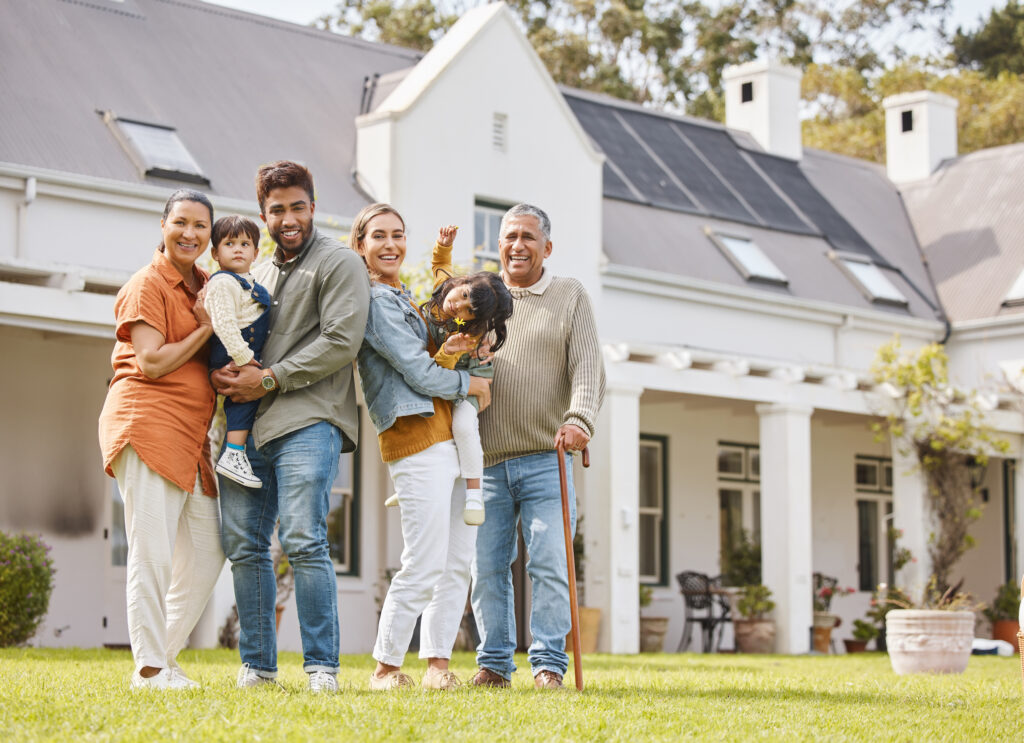 multigenerational family in front of their house