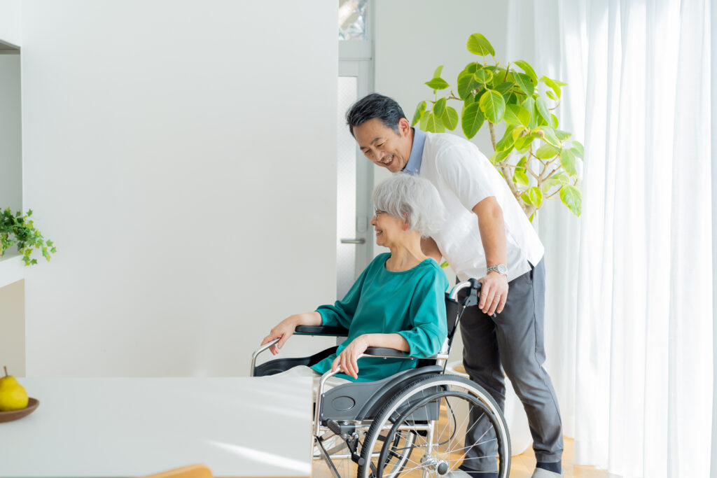 senior couple pushing a wheelchair