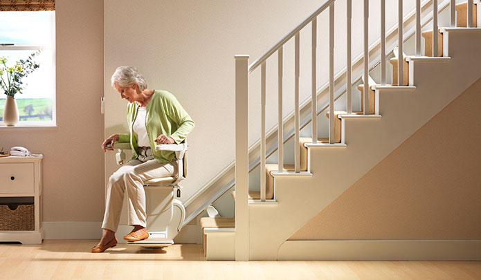 Senior on Stannah Straight Stairlifts