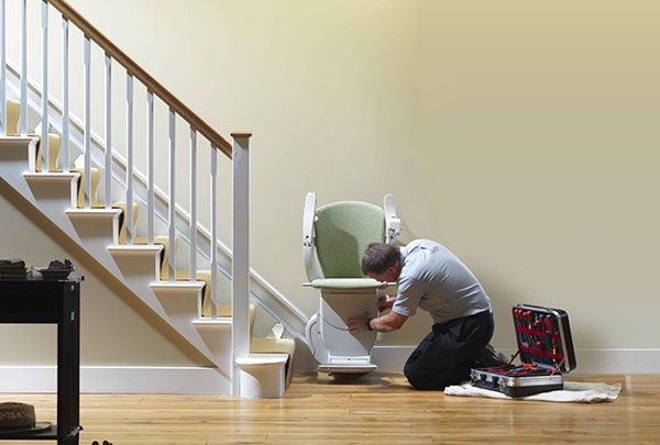 technician installing a stairlift